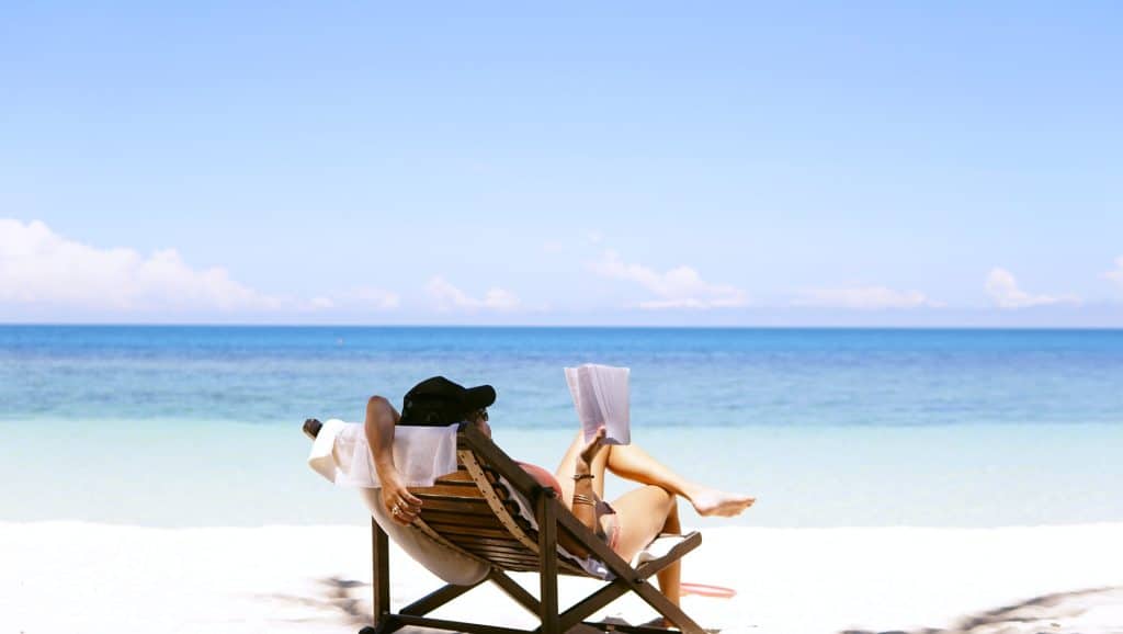 Woman reading on beach