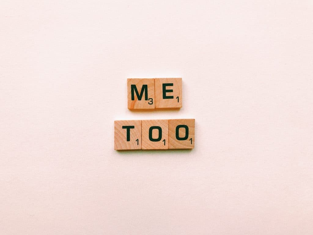 scrabble tiles spelling 'me too'