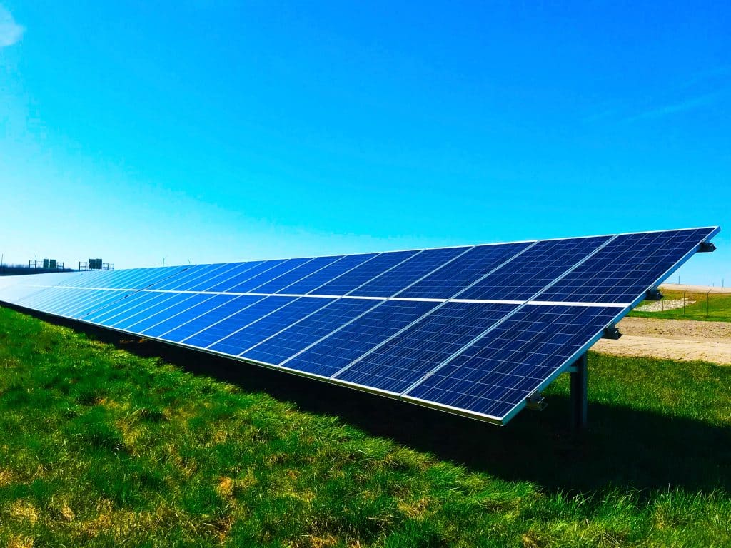 A large solar panel on a field, representing the employer, a solar company, in an employment dispute