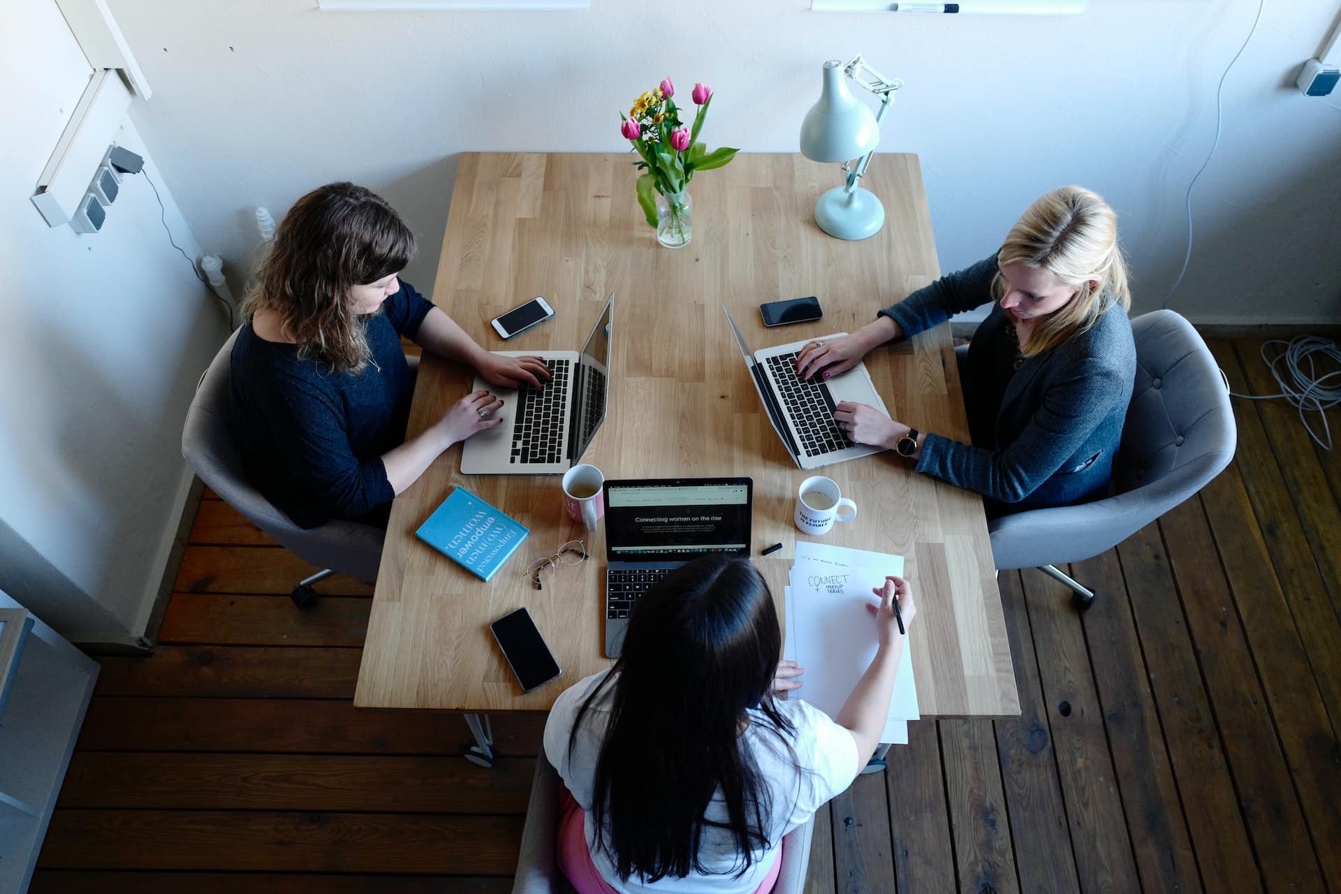 Three Ladies sitting and working