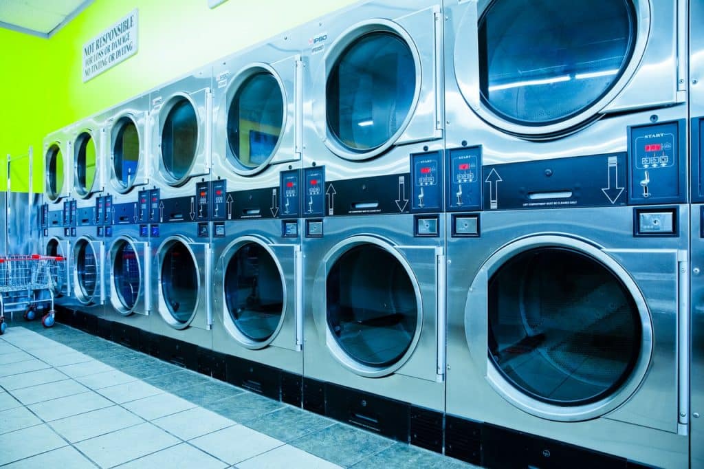 A laundromat representing a commercial laundry facility that failed to accommodate an employee's family status