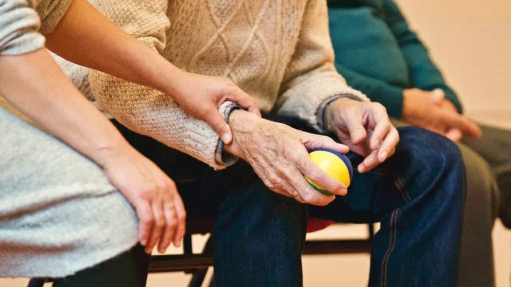 A woman caring for an elderly relative representing an employee taking emergency infectious disease leave to care for a relative