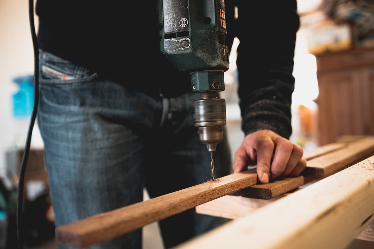 Construction worker using a drill